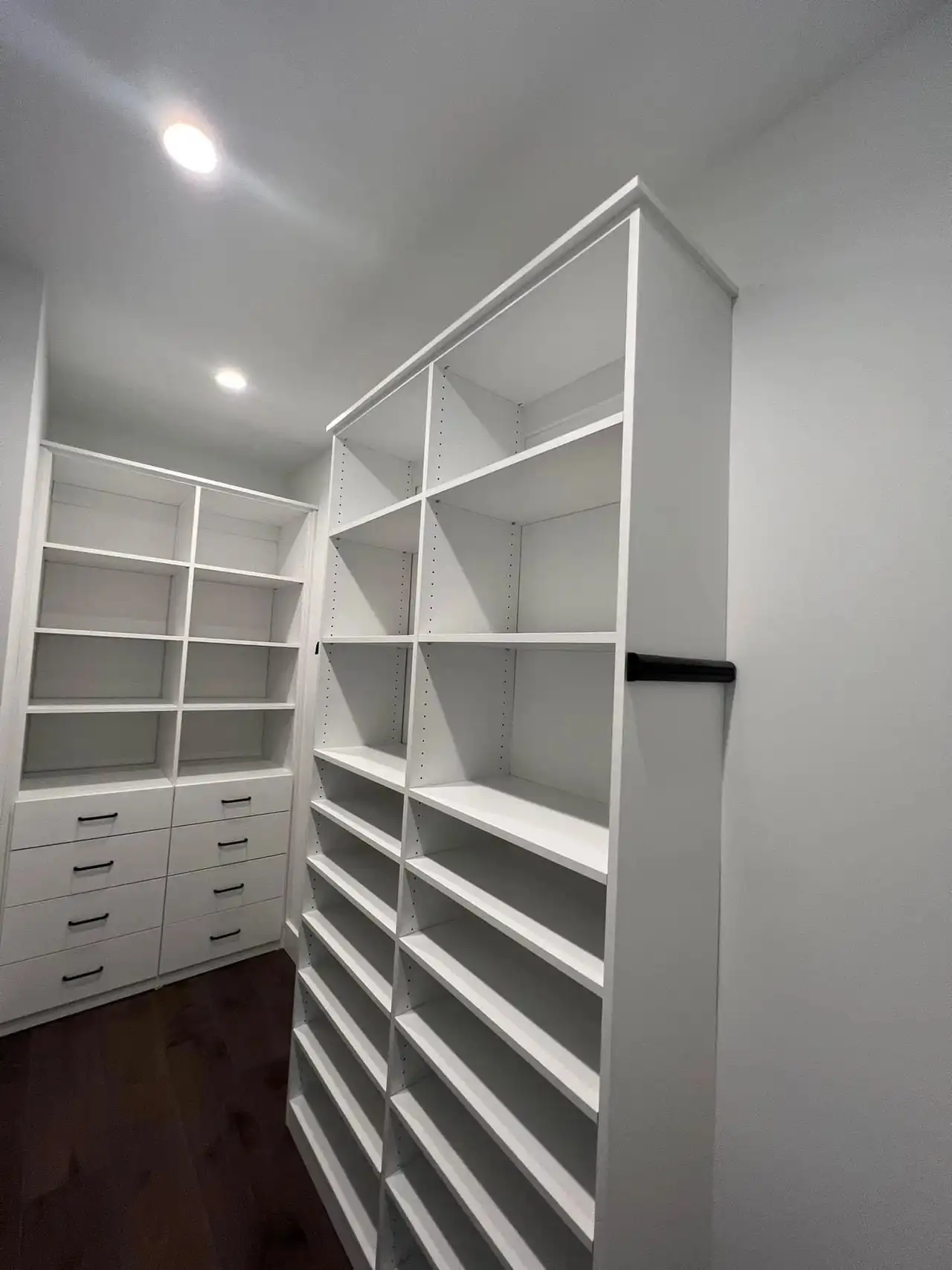 A built-in wardrobe in white, finished and fitted