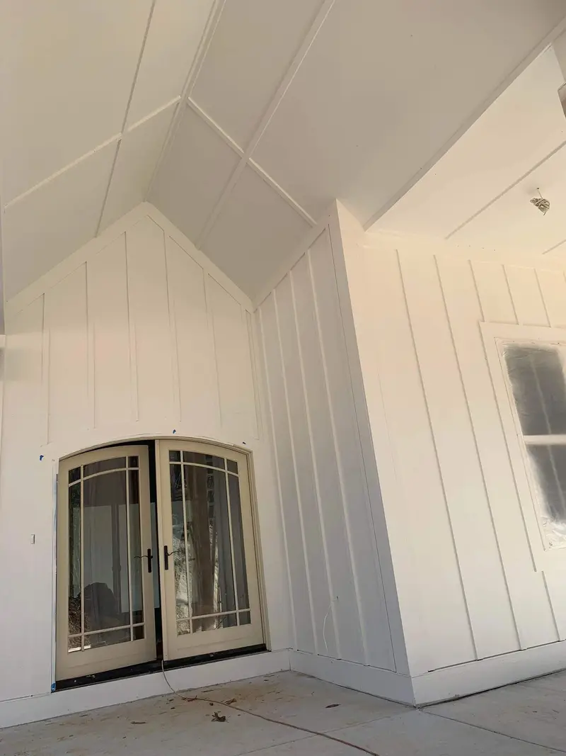 Exterior · Painted siding and arched door
