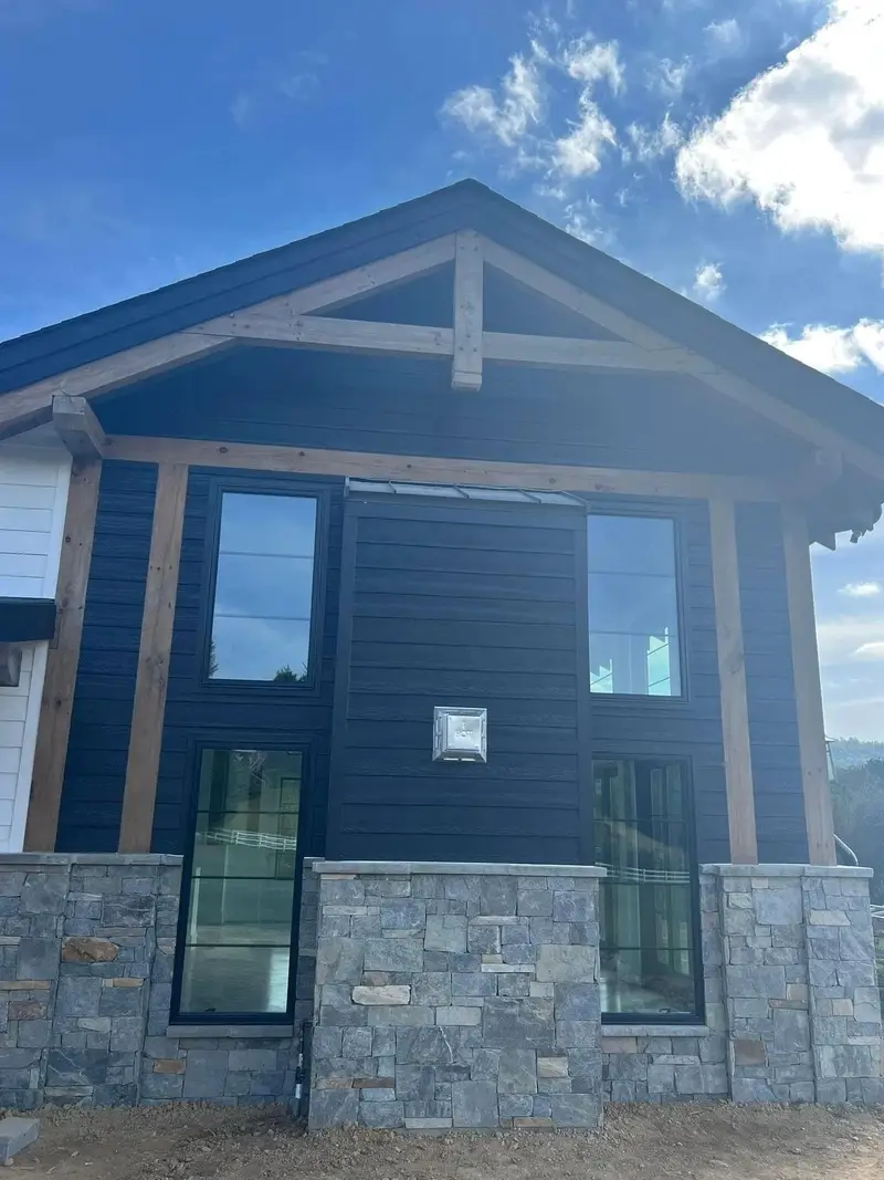 Custom home · Timber truss and stone