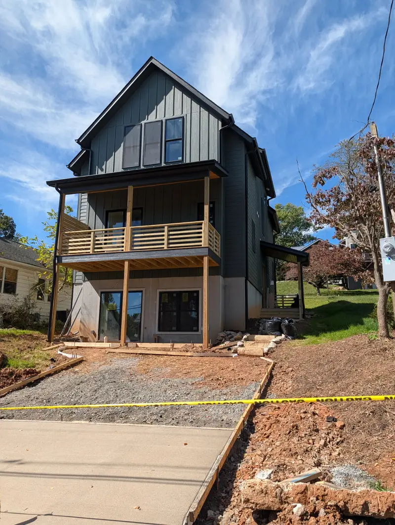 New build · Board and batten, two-storey porch